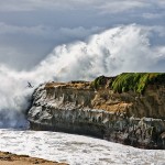 Surfer jumps off cliff