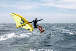 Surfer using a surf wing by F-one kites large